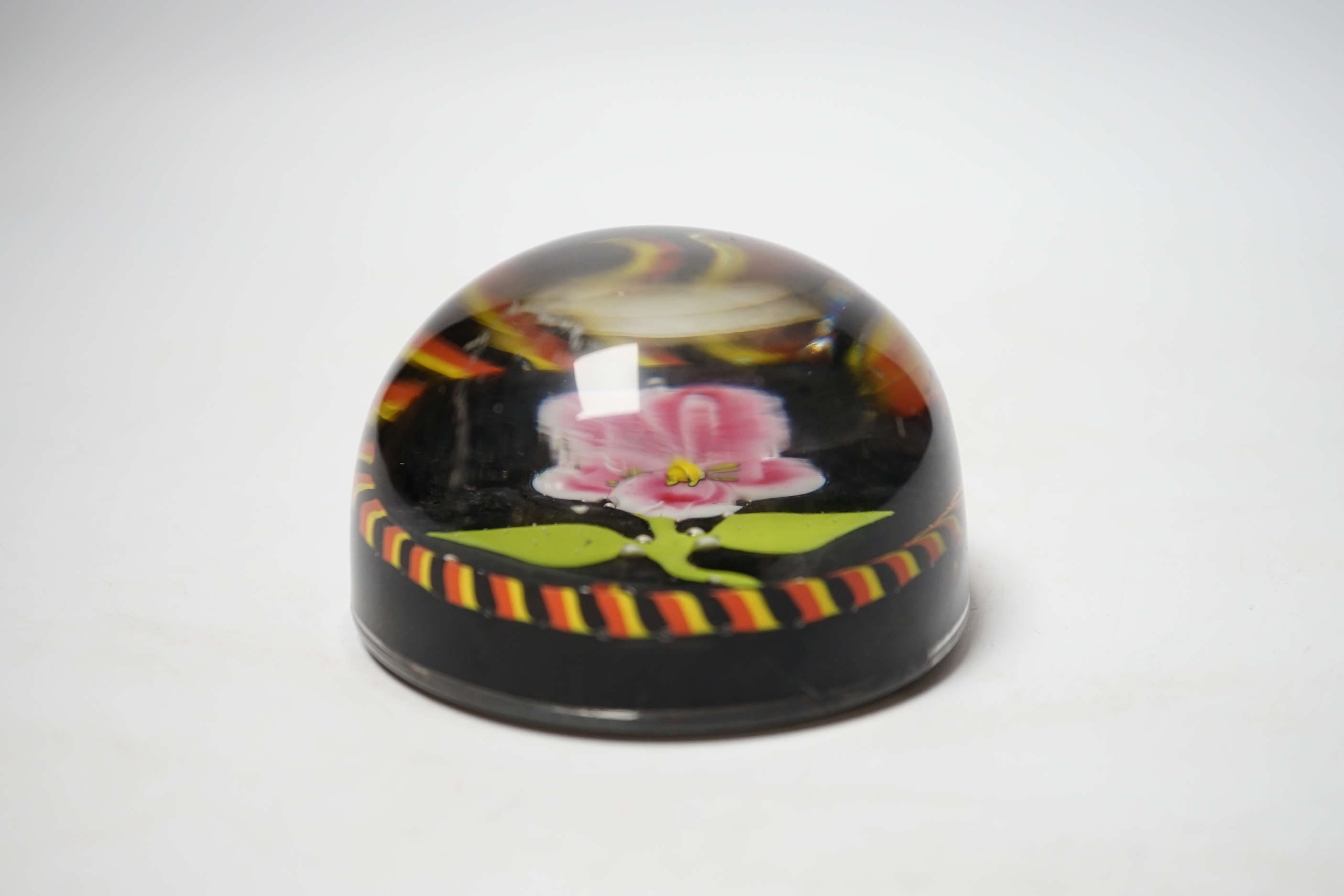 A glass ‘Flower’ paperweight, black ground, possibly Belgian, 8.5cm diameter